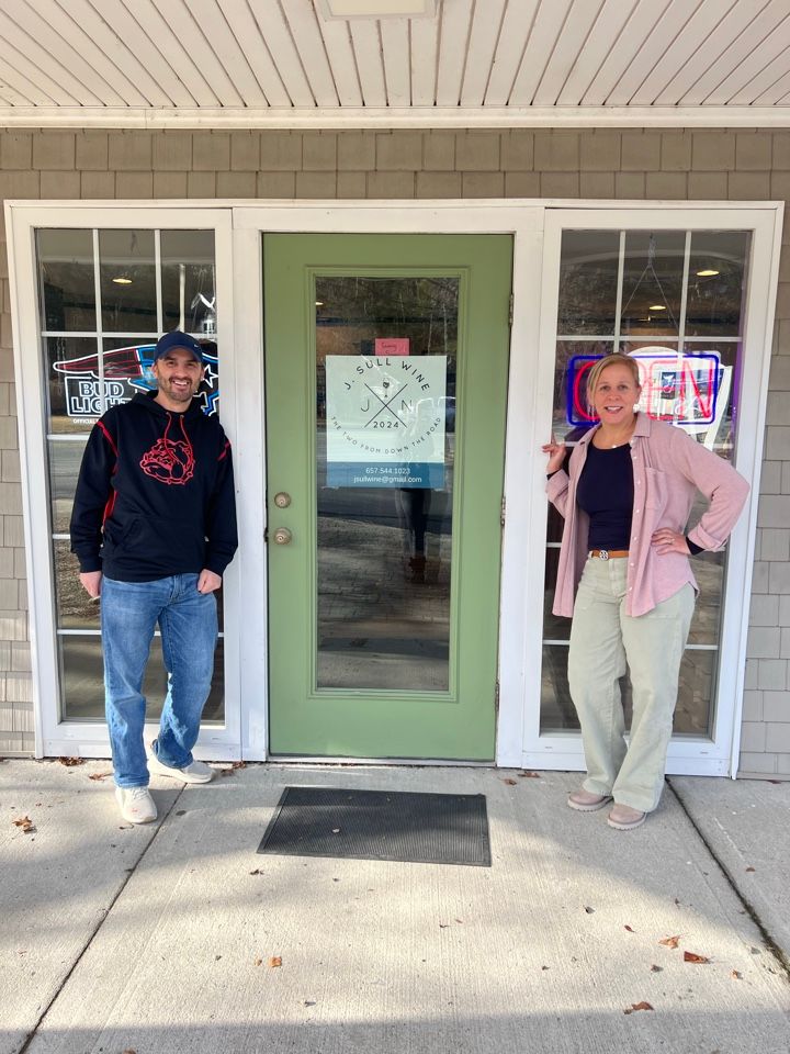 Joel and Niki outside the J. Sull Wine & Spirits shop