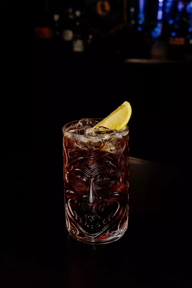 Cuba Libre served in glassware