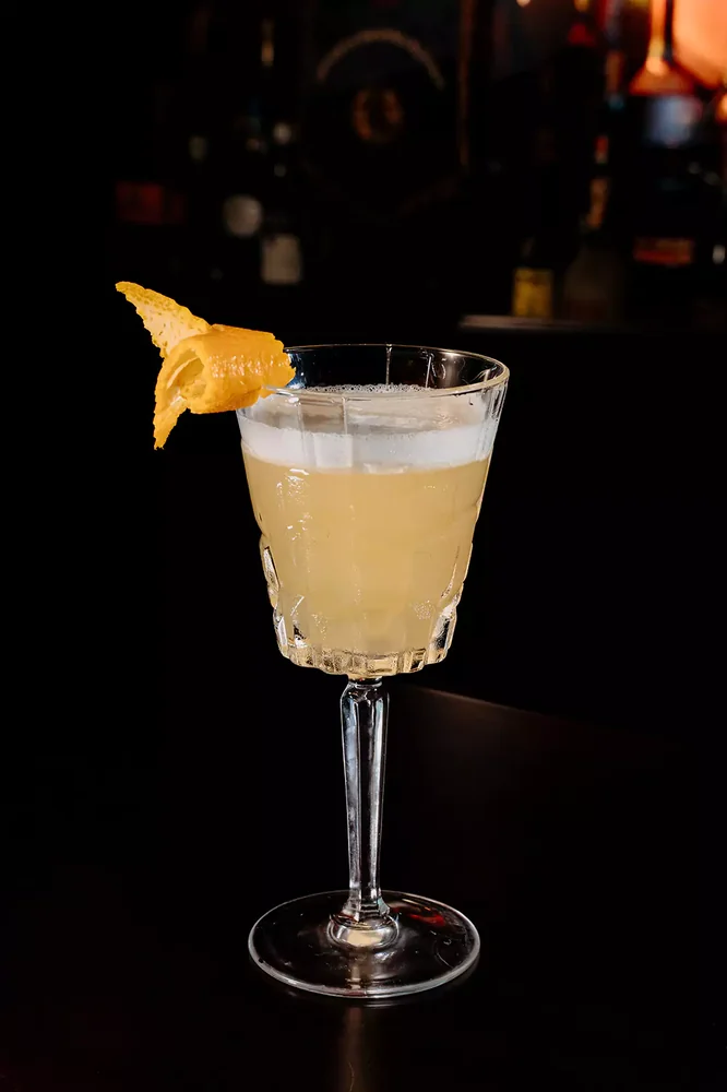 Whiskey Sour served in glassware